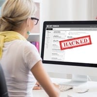 Woman looking at hacked email message