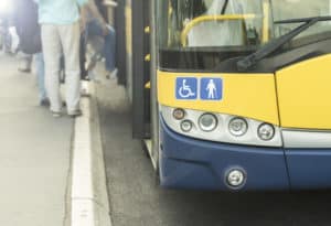 City bus with handicap symbols.