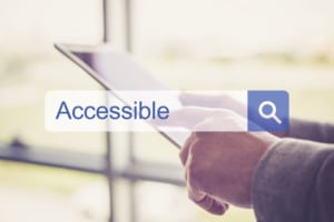 person searching for the term 'accessible' on a tablet