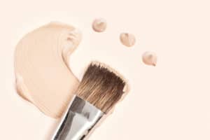 Cosmetic foundation cream and powder with brush
