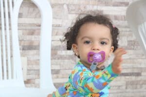 Portrait Of Baby Girl With Pacifier