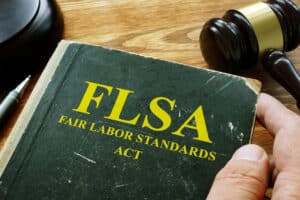 Man holds FLSA fair labor standards act.