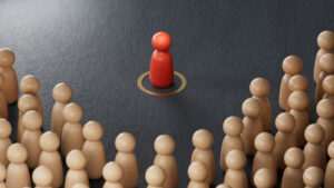 red figurine surrounded by others