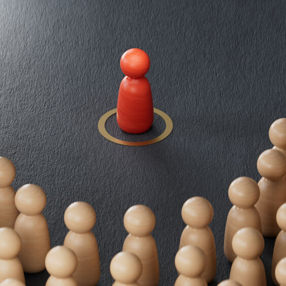 red figurine surrounded by others