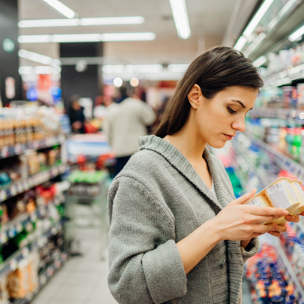 woman in grocery store aisle