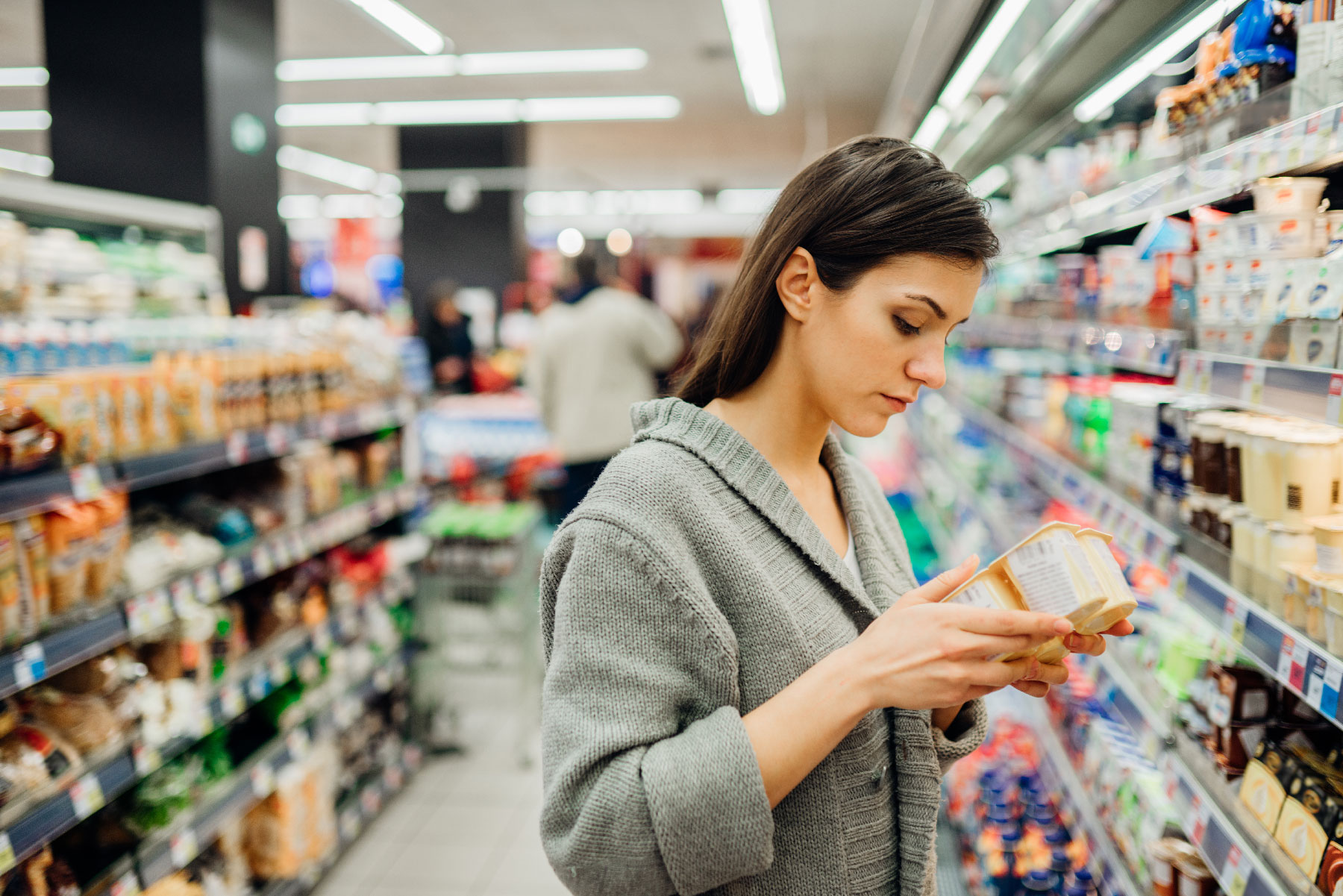 woman in grocery store aisle