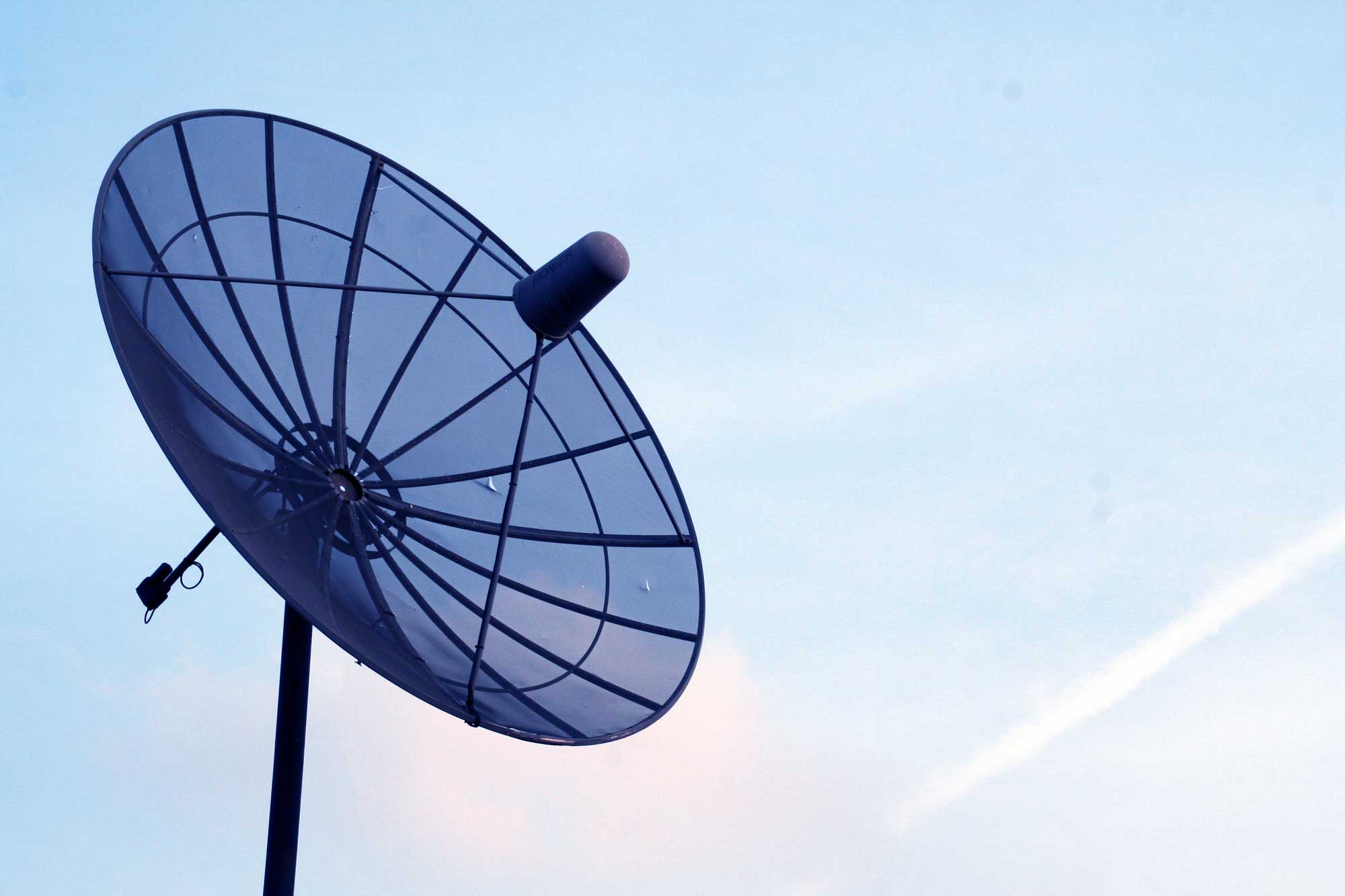 Cable satellite dish with a sky backdrop